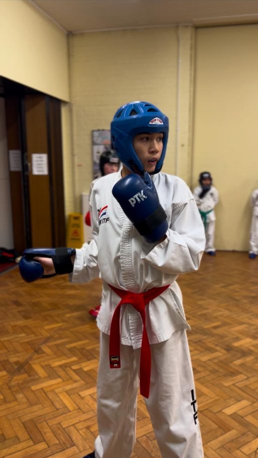 Red belt student in sparring gear